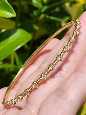 $3,200 14kt Gold Flexible Bangle with Diamonds